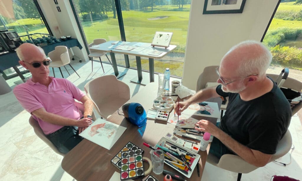 Serge Dehaes en train de faire le portrait d'un golfeur